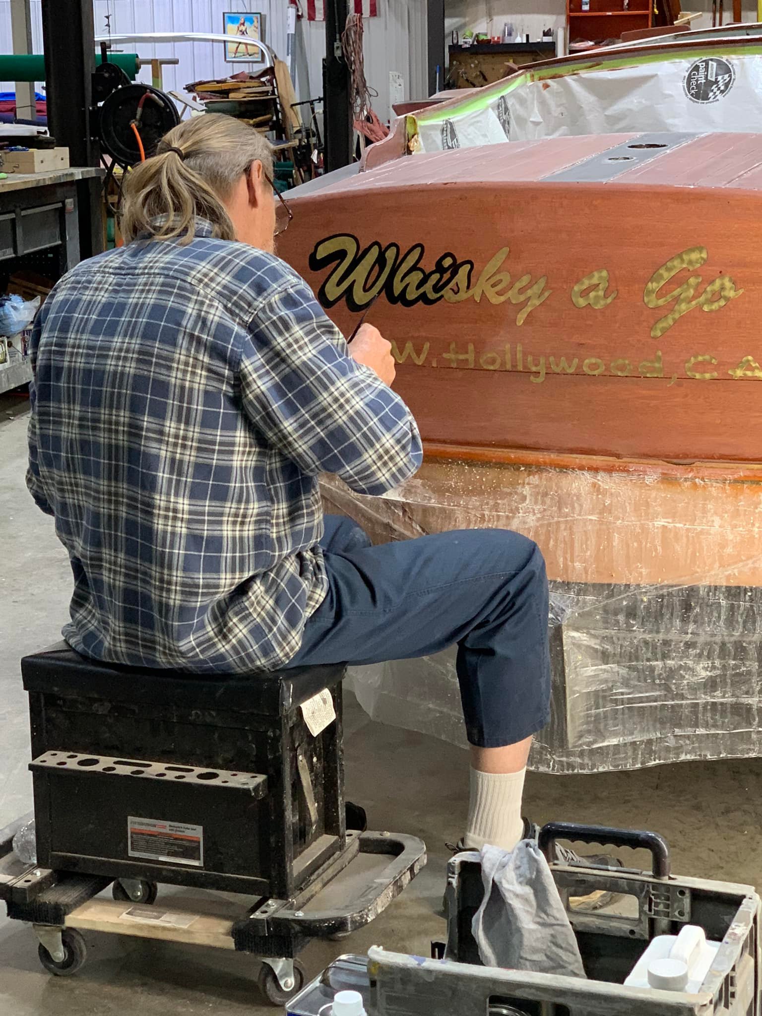 Boat repair and lettering in process at Woodies restoration in Jamestown, Kentucky