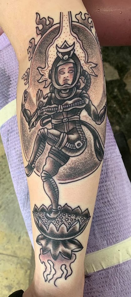 A tattoo on a person's arm. The tattoo was completed by JOhn Haywood who owns the parlor room in whitesburg, kentucky.