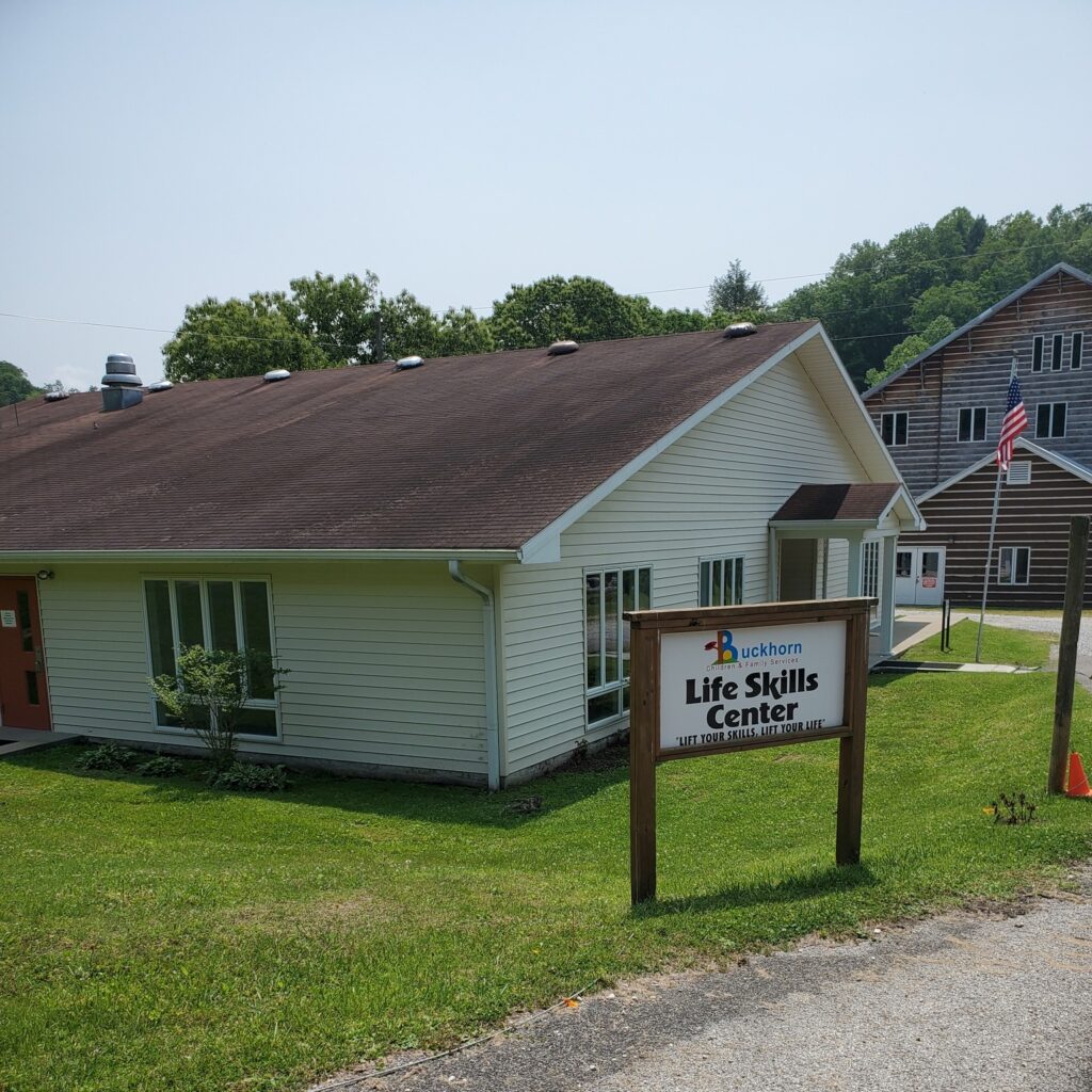 A sign reads life skills center in front of a building in perry county kentucky