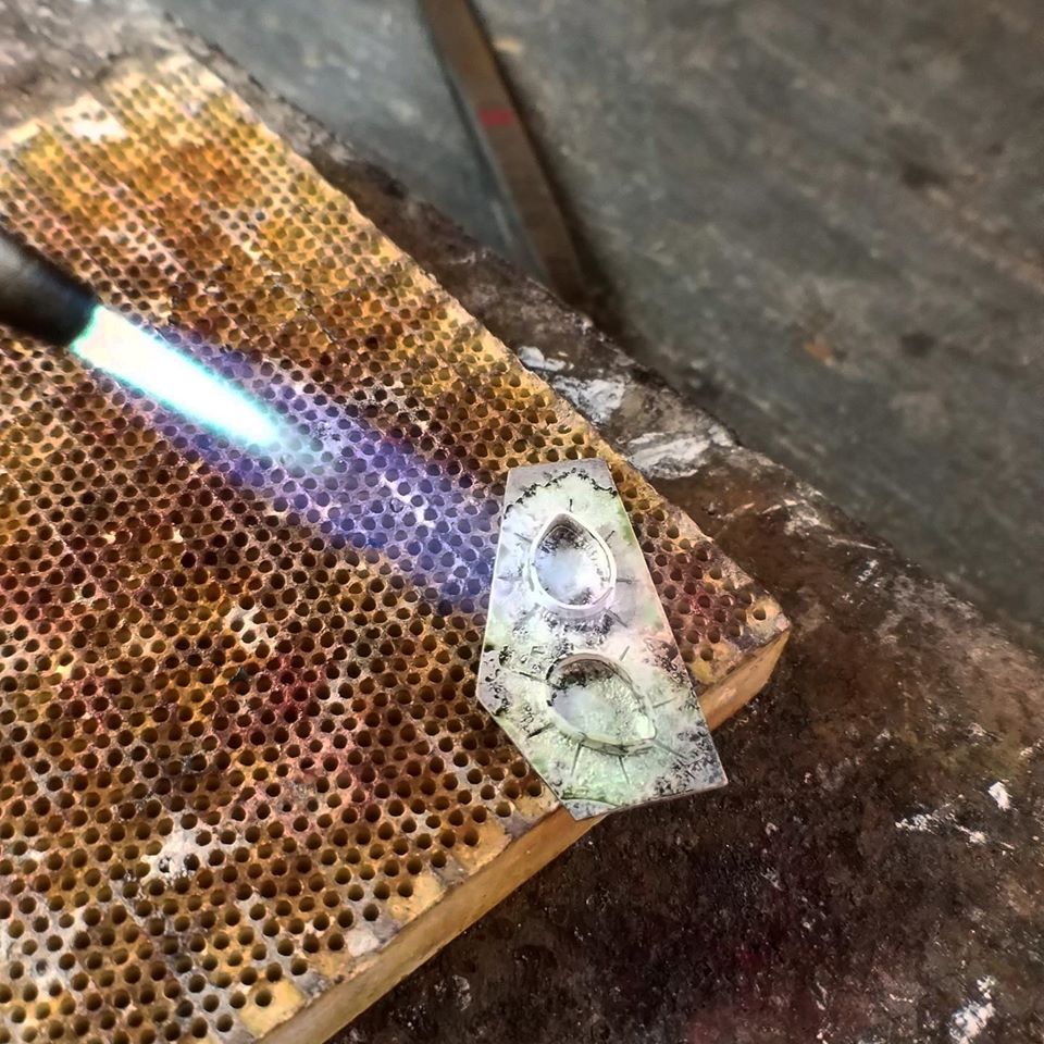 Jared Cox welding for his business Fishing Creek jewelry in Eastern Kentucky. MACED supports Appalachian artists with business loans