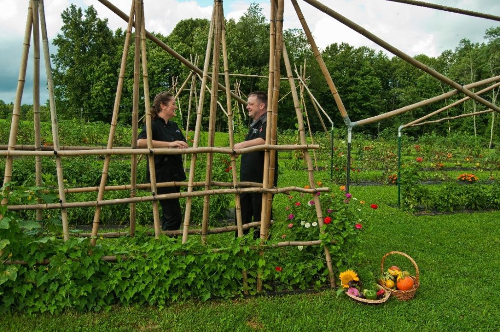 Students at Fruits of Labor stand in the garden in West Virginia. The programs include culinary arts and agriculture for at risk youth and women in recovery.