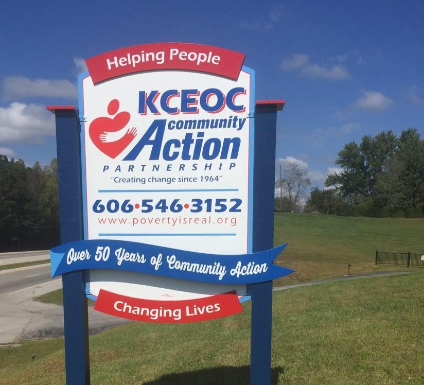 A photo of KCEOC's sign that says helping people, changing lives