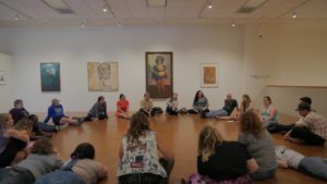 People sit in a circle during a kentucky rural urban exchange training in eastern kentucky.