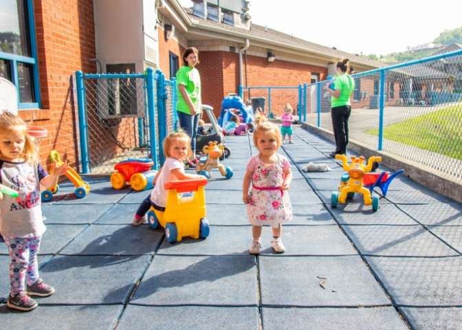 Children play outside of New Beginnings in Hazard, Kentucky. The facility helps counter a lack of Eastern Kentucky childcare access