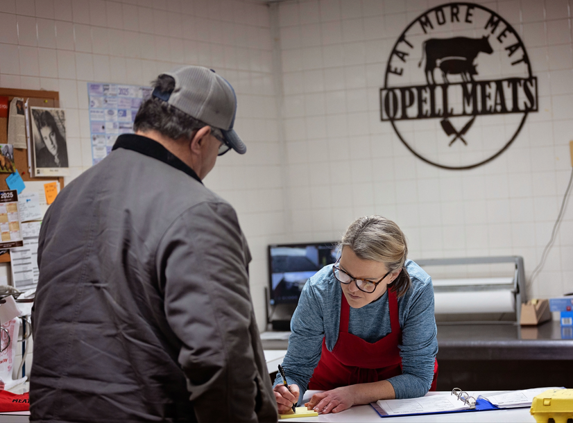 Laura takes an order for a customer at Opell Meats in Catlettsburg, KY.