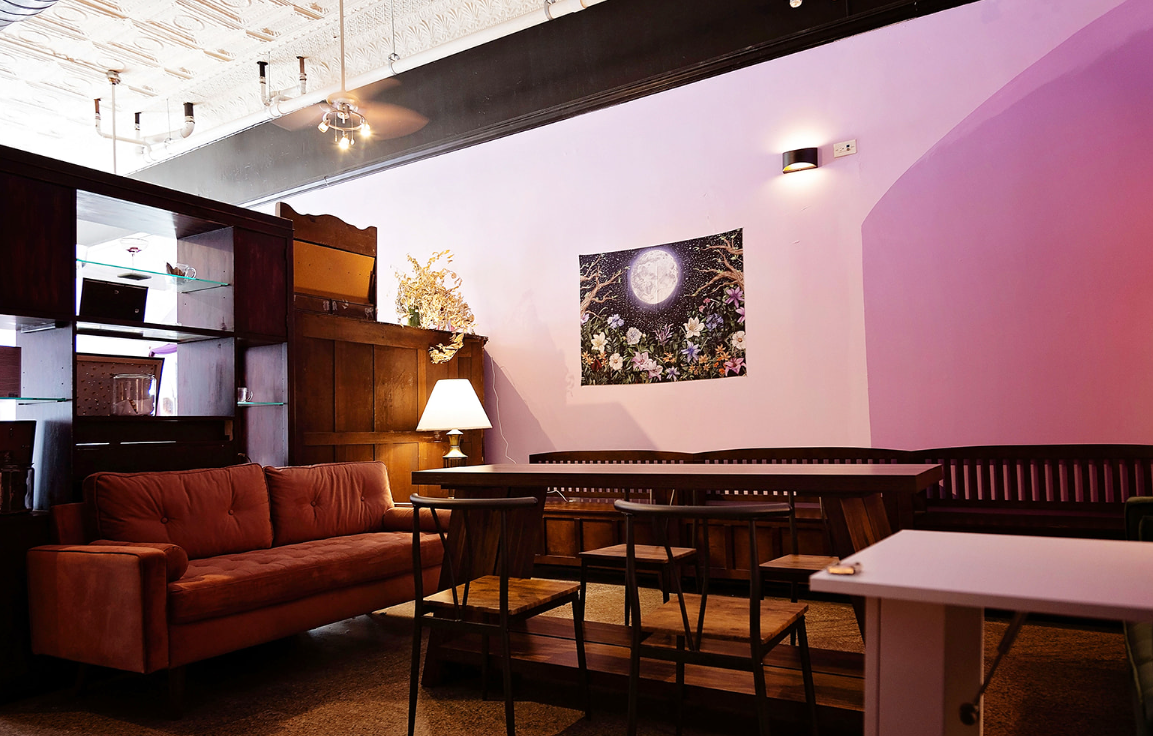 purple wall, a table and couch inside spiritual so simple in Ashland kentucky